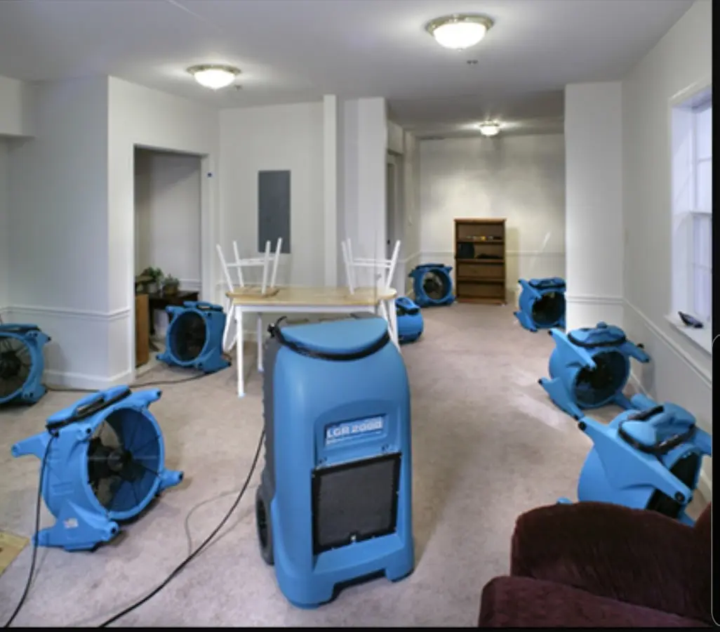Air movers and dehumidifier setup for Water Damage Restoration in Eden